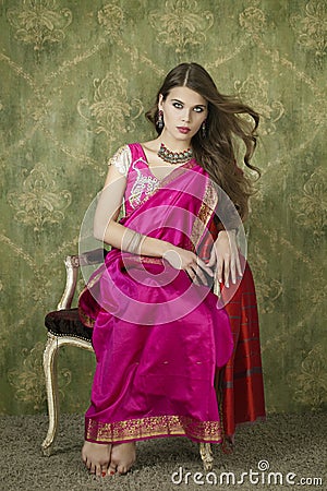 Young pretty woman in indian red dress Stock Photo