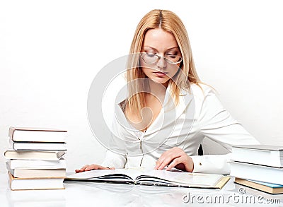 Young pretty woman learning at table with books Stock Photo