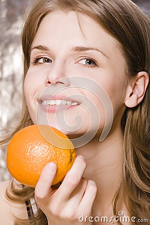 Young pretty woman with orange Stock Photo