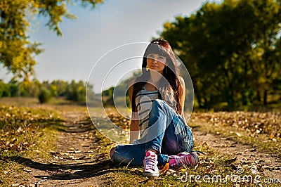 Young pretty woman in park Stock Photo