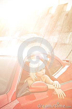 Young pretty woman and red sport car Stock Photo