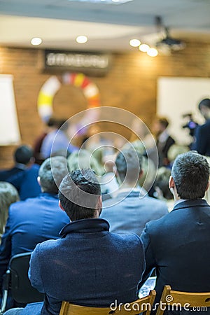 Young Professional Mediators Having a Public Discussion at the Round Table on Stage Stock Photo