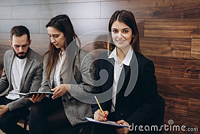 Young professionals are sitting in anticipation of the interview Stock Photo