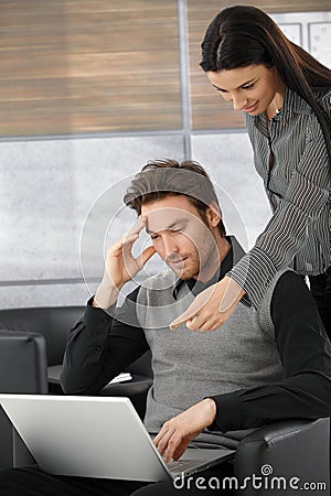 Young professionals working on laptop Stock Photo