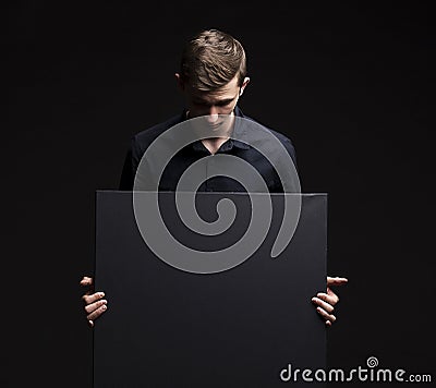 Young pry man showing presentation, pointing on placard Stock Photo