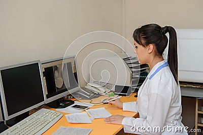 Young radiologist doctor edit and analyses the digital x ray Stock Photo