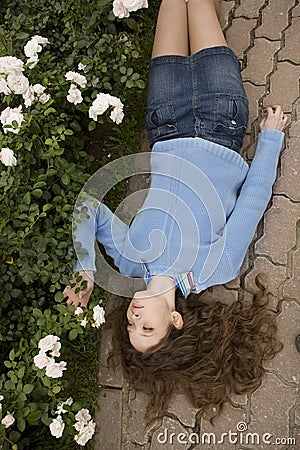 Young red hair woman lying hed over heels Stock Photo