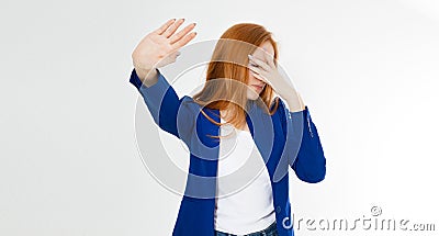 Young red hair woman making a rejection pose and facepalm on a white background. Negative human emotion face expression feeling Stock Photo