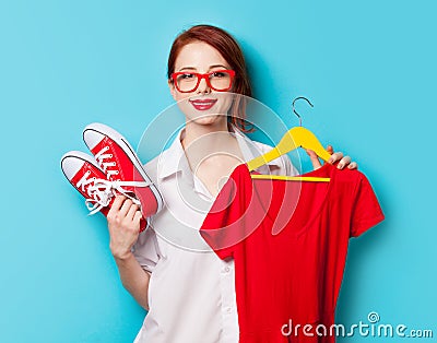 Young redhead designer with dress and gumshoes Stock Photo