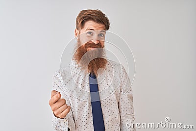 Young redhead irish businessman standing over isolated white background Beckoning come here gesture with hand inviting welcoming Stock Photo