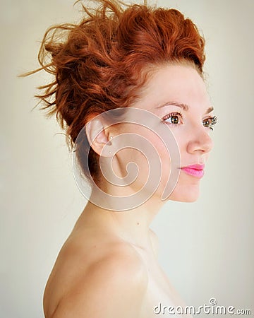 Young redhead with punky hair and tragus piercing Stock Photo