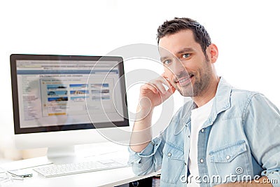 Young relaxed man using computer Stock Photo