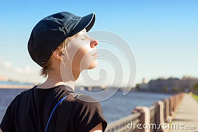 Young relaxing woman at sunny day Stock Photo