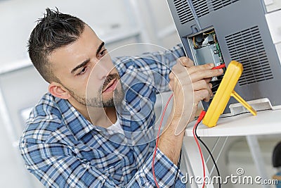Young repairer working in service center Stock Photo