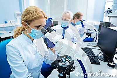 Young researcher working with chromosomes Stock Photo