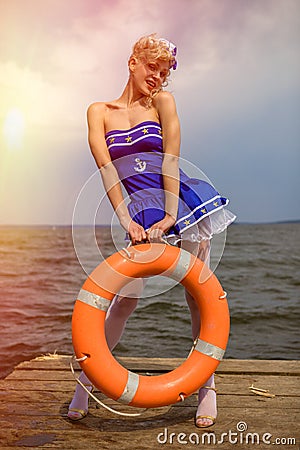 Young retro pinup girl with blond curly hair style and beau Stock Photo