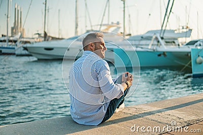 Young rich man at Yacht Club. Businessman is Relaxing Stock Photo