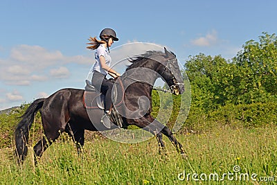 Young riding girl Stock Photo