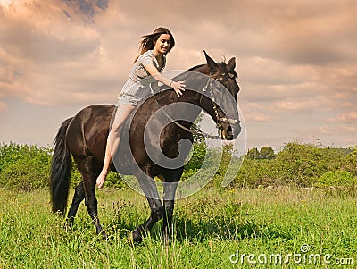 Young riding girl Stock Photo