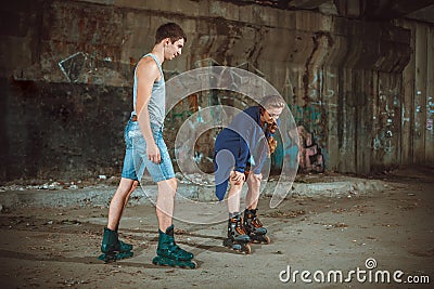 Young roller couple on graffiti background Stock Photo