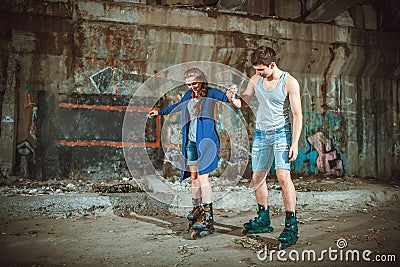 Young roller couple on graffiti background Stock Photo
