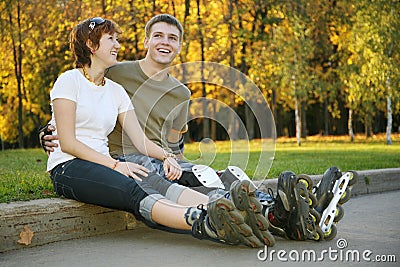 Young roller couple sit Stock Photo