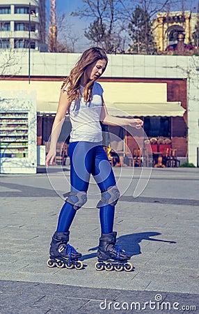 Young Roller Girl is learning how to skate Stock Photo