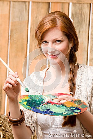 Young romantic woman hold color palette barn Stock Photo