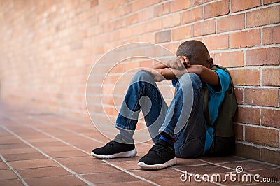 Young sad boy at school Stock Photo