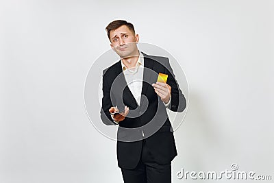 Young successful handsome rich business man in black suit on white background for advertising. Stock Photo