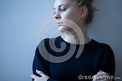 Young sad woman with anxiety disorder, anorexia ans loneliness concept Stock Photo