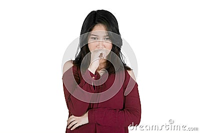 Young sad woman thinking something on studio Stock Photo