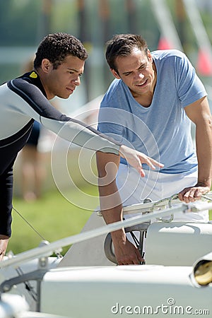 young sailing instructor instructs with student Stock Photo