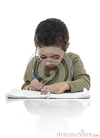 Young Schoolboy Studying with Concentration Stock Photo