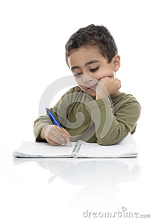 Young Schoolboy Studying Hard Stock Photo