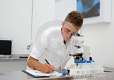 Young scientist collecting data Stock Photo