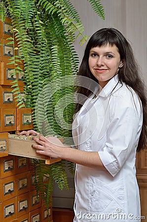 A young scientist near the file-cabinet Stock Photo