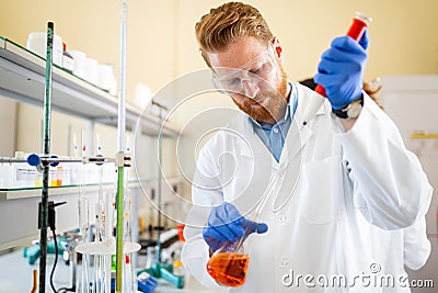 Young scientist student man working at the laboratory Stock Photo