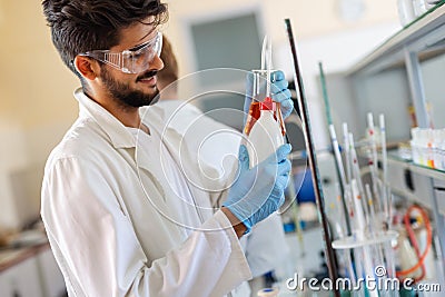 Young scientist student man working at the laboratory Stock Photo