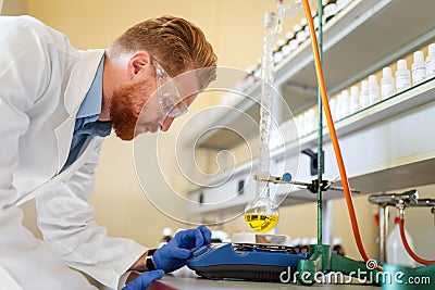 Young scientist student man working at the laboratory Stock Photo