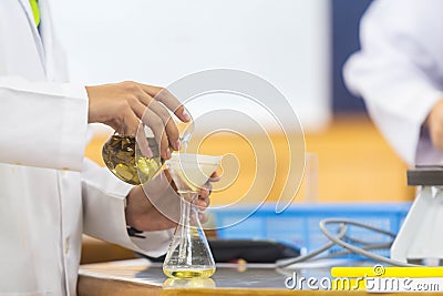 Young scientists are doing experiments in science labs. Stock Photo