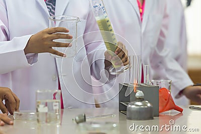 Young scientists are doing experiments in science labs. Stock Photo