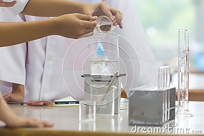 Young scientists are doing experiments in science labs. Stock Photo