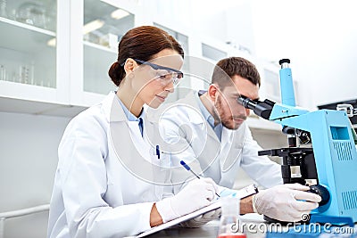 Young scientists making test or research in lab Stock Photo