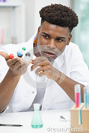 Young scientists studying dna models Stock Photo