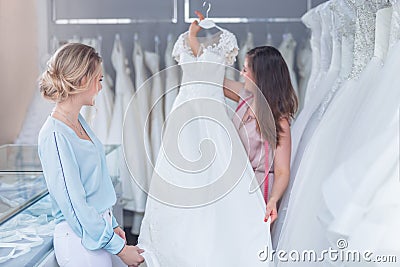 Young seller and happy customer in a shop Stock Photo