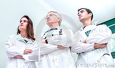 Young and senior doctors ready to fight against coronavirus outbreak at hospital clinic - Medical emergency concept Stock Photo