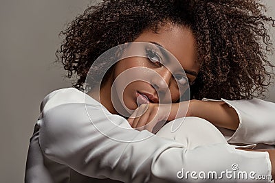 Young sensual african american woman in white shirt looking away Stock Photo