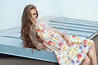 Young sensuality long haired blonde model in cute dress Stock Photo