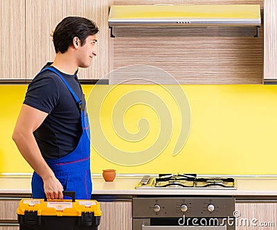 Young service contractor assembling kitchen furniture Stock Photo